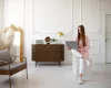 woman using laptop minimal decorated room