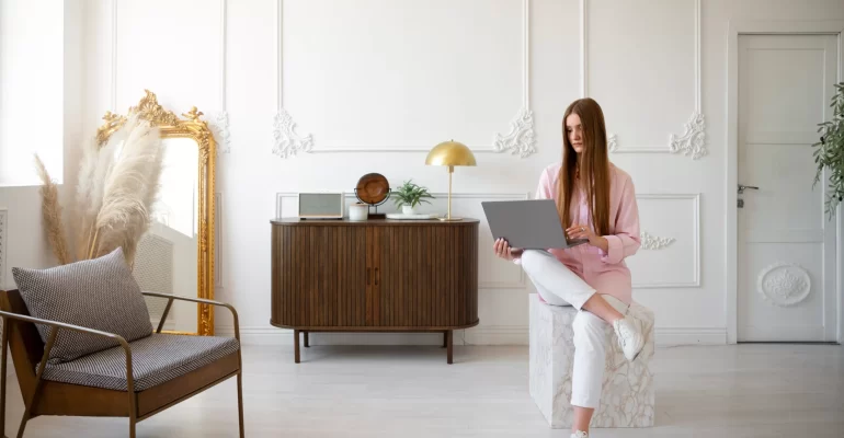 woman using laptop minimal decorated room